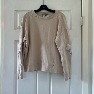 beige sweatshirt with heart patches